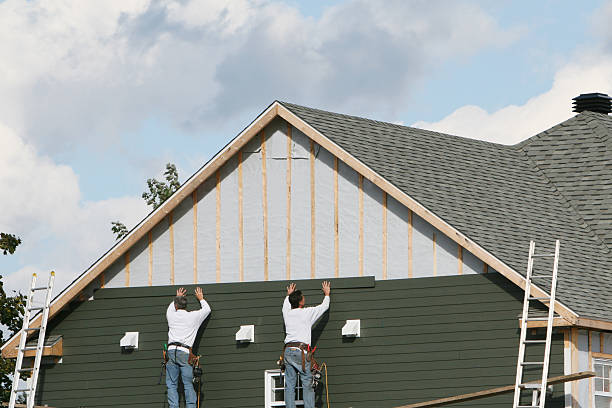 Professional Storm Damage Siding Repair technician working in Conway, FL